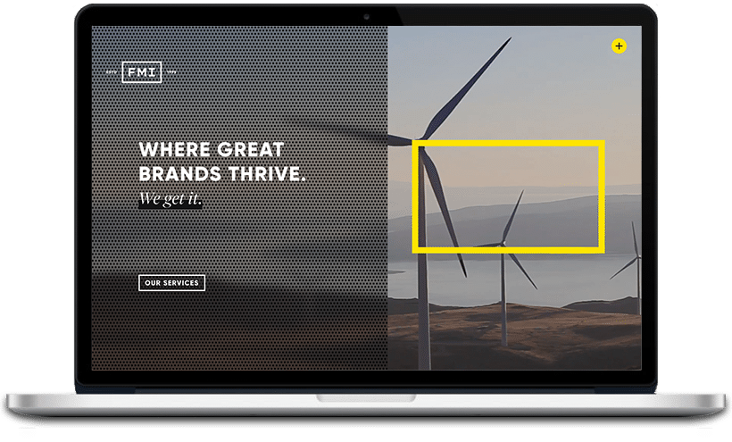 This image features a laptop displaying a website with a black perforated background and text saying "WHERE GREAT BRANDS THRIVE. We get it." There's also a button labeled "OUR SERVICES" and a landscape with wind turbines in the background.